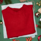 Red sweater on Christmas background Red sweater on Christmas background - PhotoDune Item for Sale