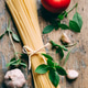 Italian pasta food ingredients on rustic wooden table Top view of spaghetti garlic tomato and basil Italian pasta food ingredients on rustic wooden table Top view of spaghetti garlic tomato and basil - PhotoDune Item for Sale