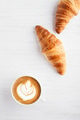 Two Croissants and a Cup of Cappuccino. Two Croissants and a Cup of Cappuccino. - PhotoDune Item for Sale