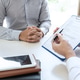 Doctor presenting with patient and checking results on report and prescription about the problem of Doctor presenting with patient and checking results on report and prescription about the problem of - PhotoDune Item for Sale