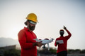 Drone engineer working with futuristic glasses on construction site - Aerial engineering concept Drone engineer working with futuristic glasses on construction site - Aerial engineering concept - PhotoDune Item for Sale