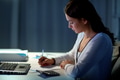 woman with calculator and papers at night office woman with calculator and papers at night office - PhotoDune Item for Sale