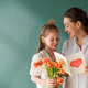 Happy Mother and Daughter Celebrating with Tulips and Handmade Card Indoors Happy Mother and Daughter Celebrating with Tulips and Handmade Card Indoors - PhotoDune Item for Sale