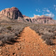 Rocky path and mountains in deseert at bright sunny day in Nevada Rocky path and mountains in deseert at bright sunny day in Nevada - PhotoDune Item for Sale