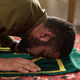 Young Adult Man Praying on Carpet during Muslim Religious Ritual Young Adult Man Praying on Carpet during Muslim Religious Ritual - PhotoDune Item for Sale
