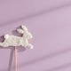 Easter Bunny Stick and Pastel Purple Background under Sunlight Easter Bunny Stick and Pastel Purple Background under Sunlight - PhotoDune Item for Sale