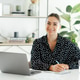 Happy successful businesswoman, manager or secretary, sitting at the desk with laptop, holding a pen Happy successful businesswoman, manager or secretary, sitting at the desk with laptop, holding a pen - PhotoDune Item for Sale