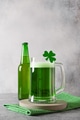 Patrick's day green beer in glass on gray. Patrick's day green beer in glass on gray. - PhotoDune Item for Sale