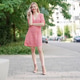 Smiling Woman on Phone Wearing Summer Dress in City Smiling Woman on Phone Wearing Summer Dress in City - PhotoDune Item for Sale
