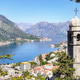 Beautiful view of the sunny Bay of Kotor among the mountains and the coastal town near the chapel Beautiful view of the sunny Bay of Kotor among the mountains and the coastal town near the chapel - PhotoDune Item for Sale
