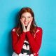 Winter holidays and Christmas Eve concept. Adorable redhead girl blushing and touching cheeks from Winter holidays and Christmas Eve concept. Adorable redhead girl blushing and touching cheeks from - PhotoDune Item for Sale