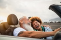 Happy senior couple having fun driving on new convertible car Happy senior couple having fun driving on new convertible car - PhotoDune Item for Sale