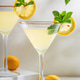 Bright cocktail with two glasses of limoncello spritz with fresh lemon slices and mint sprigs Bright cocktail with two glasses of limoncello spritz with fresh lemon slices and mint sprigs - PhotoDune Item for Sale