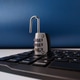 The image displays combination padlock resting on a computer keyboard, symbolizing digital security The image displays combination padlock resting on a computer keyboard, symbolizing digital security - PhotoDune Item for Sale
