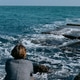 Beautiful blue sea and woman from behind Beautiful blue sea and woman from behind - PhotoDune Item for Sale
