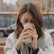 Young brunette woman holding plastic cup, drinking coffee, enjoying the moment outside Young brunette woman holding plastic cup, drinking coffee, enjoying the moment outside - PhotoDune Item for Sale