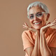 Close-up portrait of a attractive beautiful confident gray-haired mature woman wearing transparent Close-up portrait of a attractive beautiful confident gray-haired mature woman wearing transparent - PhotoDune Item for Sale