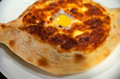 Ajarian khachapuri Georgian cheese pie with egg close Ajarian khachapuri Georgian cheese pie with egg close - PhotoDune Item for Sale