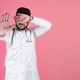 Handsome doctor, intern, pharmacist wearing uniform, closing eyes, stretching hand. Handsome doctor, intern, pharmacist wearing uniform, closing eyes, stretching hand. - PhotoDune Item for Sale