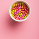 Colorful hard mint Candies in bowl on pink background. Top view. Colorful hard mint Candies in bowl on pink background. Top view. - PhotoDune Item for Sale