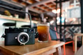 Vintage camera and ice brew coffee on wooden table Vintage camera and ice brew coffee on wooden table - PhotoDune Item for Sale