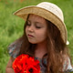 a cute blonde six-year-old girl closed her eyes from the sun, holding a bouquet of red poppies a cute blonde six-year-old girl closed her eyes from the sun, holding a bouquet of red poppies - PhotoDune Item for Sale