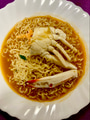 A plate of instant curry egg noodles served with crab A plate of instant curry egg noodles served with crab - PhotoDune Item for Sale