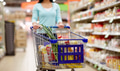 woman with food in shopping cart at supermarket woman with food in shopping cart at supermarket - PhotoDune Item for Sale