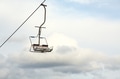 Empty chairlift with cloudy sky in the background Empty chairlift with cloudy sky in the background - PhotoDune Item for Sale