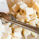Pieces and cubes of cheese Pieces and cubes of cheese - PhotoDune Item for Sale