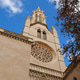 Gothic-style church facade with tall tower, rose window and stone ornaments Gothic-style church facade with tall tower, rose window and stone ornaments - PhotoDune Item for Sale