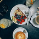 Romantic breakfast for two featuring coffee, fruits, and chocolate cake on a bistro table Romantic breakfast for two featuring coffee, fruits, and chocolate cake on a bistro table - PhotoDune Item for Sale