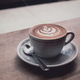 A cappuccino on a windowsill in a coffee shop. A cappuccino on a windowsill in a coffee shop. - PhotoDune Item for Sale