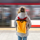 a person standing on a subway platform, facing away from the camera, as a train speeds by in a blur a person standing on a subway platform, facing away from the camera, as a train speeds by in a blur - PhotoDune Item for Sale