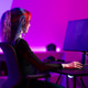 Young female gamer immersed in a vibrant gaming environment Young female gamer immersed in a vibrant gaming environment - PhotoDune Item for Sale