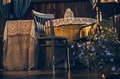 An empty brown chair next to a table. An empty brown chair next to a table. - PhotoDune Item for Sale