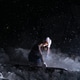 A girl snowboarder sitting in the snow at night A girl snowboarder sitting in the snow at night - PhotoDune Item for Sale