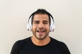 Hispanic man listening music with headphones outdoor Hispanic man listening music with headphones outdoor - PhotoDune Item for Sale