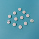 White pills on a blue background White pills on a blue background - PhotoDune Item for Sale