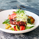 Octopus salad with vegetables in a white plate Octopus salad with vegetables in a white plate - PhotoDune Item for Sale