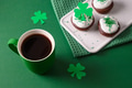 Coffee and three cupcakes for celebration St Patricks Day. Coffee and three cupcakes for celebration St Patricks Day. - PhotoDune Item for Sale