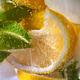 Macro photo of fresh lime and lemon slices with bubbles in the glass. Summer cold drink Macro photo of fresh lime and lemon slices with bubbles in the glass. Summer cold drink - PhotoDune Item for Sale