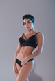 attractive sexy girl in black lingerie looking at camera isolated on grey attractive sexy girl in black lingerie looking at camera isolated on grey - PhotoDune Item for Sale