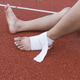 man applying compression bandage onto ankle injury After exercise concept Sports injuries. man applying compression bandage onto ankle injury After exercise concept Sports injuries. - PhotoDune Item for Sale