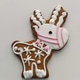 Gingerbread reindeer cookie with white icing and pink details on white background Gingerbread reindeer cookie with white icing and pink details on white background - PhotoDune Item for Sale