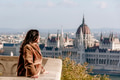 Side view of young woman on balcony overlooking Hungarian Parliament in Budapest, Hungary Side view of young woman on balcony overlooking Hungarian Parliament in Budapest, Hungary - PhotoDune Item for Sale