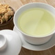 Cup of Chinese dried white chrysanthemum flowers tea close up Cup of Chinese dried white chrysanthemum flowers tea close up - PhotoDune Item for Sale