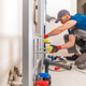 Plumber Works on Pipe Fittings in Indoor Space Plumber Works on Pipe Fittings in Indoor Space - PhotoDune Item for Sale
