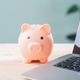 piggy bank for online money learning e education elearning internet sits on wooden office table piggy bank for online money learning e education elearning internet sits on wooden office table - PhotoDune Item for Sale