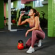 Athletic woman drinking water after kettlebell workout in gym Athletic woman drinking water after kettlebell workout in gym - PhotoDune Item for Sale